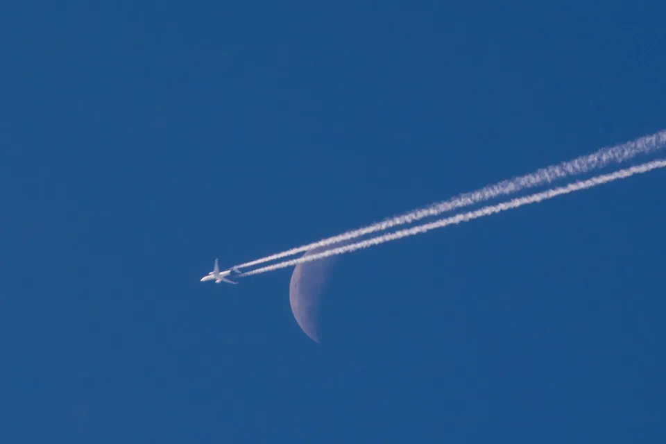 Plane traversing the Moon: astrophotograph by Pete Lawrence